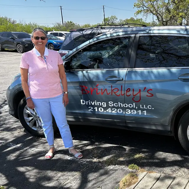 Evelyn Brinkley with Brinkley's Driving School vehicle